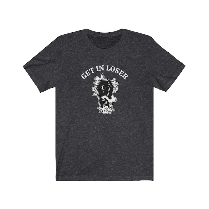 May include: A dark heather grey t-shirt with the text "GET IN LOSER" above a black and white illustration of a coffin with a crescent moon and flowers.