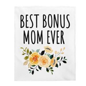 May include: White throw blanket with the text "Best Bonus Mom Ever" in black lettering and a floral design with yellow and green flowers.
