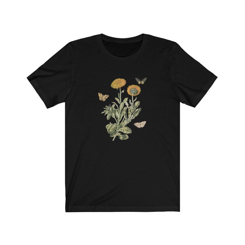 May include: Black t-shirt with a vintage botanical illustration of yellow flowers and butterflies.