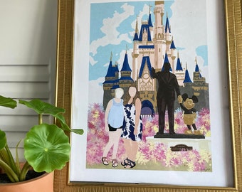 May include: A framed illustration of a family of three standing in front of Cinderella's Castle at Walt Disney World. The castle is pink and blue with gold accents. The family is wearing casual clothing and smiling. The illustration is set against a blue sky with white clouds. The frame is gold with a decorative border.