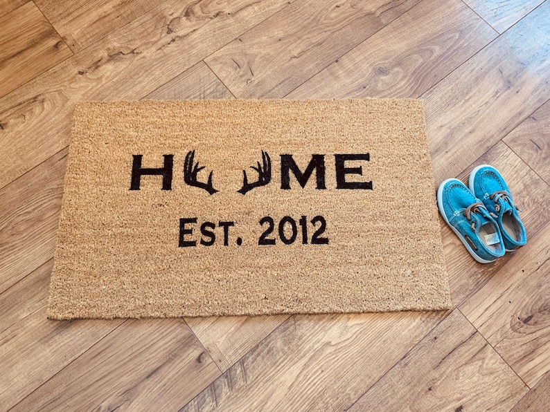 A rectangular doormat made from 100% natural fibers from the husks of coconuts engraved with your chosen date, and letters are the best gift for a hunting man.