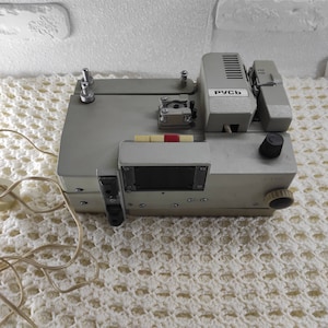movie projector,projector,movie,film projector,vintage movie