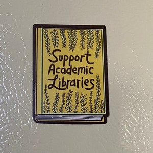 May include: A yellow book with a brown spine and green vines on the cover. The text on the cover reads "Support Academic Libraries".