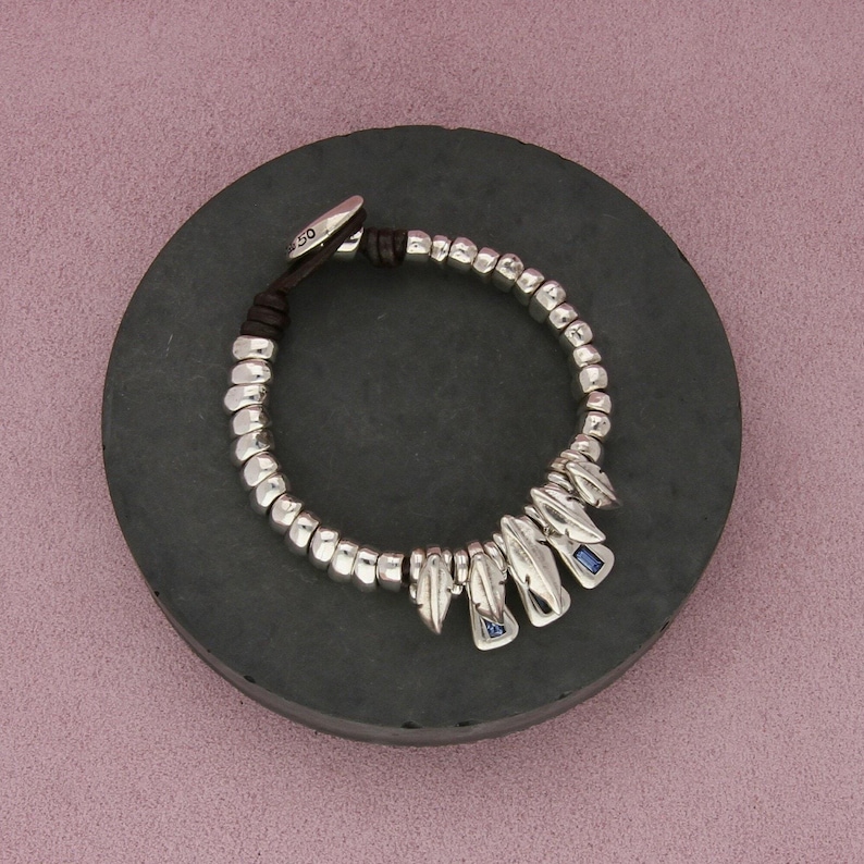 uno de 50 silver plated blue crystal feathers leather bracelet size 7in image 1