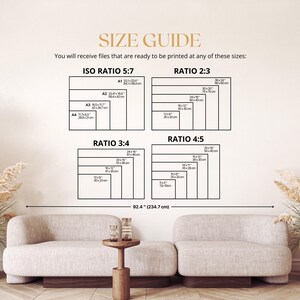 May include: A size guide chart with dimensions in inches and centimeters, including ISO Ratio 5:7, Ratio 2:3, Ratio 3:4, and Ratio 4:5. The text states, "You will receive files that are ready to be printed at any of these sizes:" The image is displayed above a beige sofa.