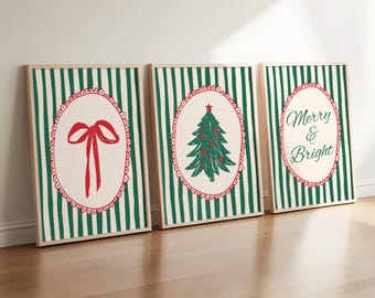 May include: Three framed Christmas art prints. Each print features a cream-colored oval design with a red border and a green and white striped background. The prints display a red bow, a Christmas tree, and the words "Merry & Bright."