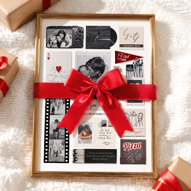 May include: A framed collage with a gold border, featuring black and white photos, cards, and text. A large red ribbon is tied around the frame. The collage includes the text "S+B The Perfect Match", "First Love", and "Love is about finding someone you can't imagine living without."