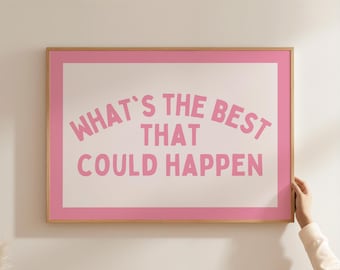 May include: A framed print with the text "WHAT'S THE BEST THAT COULD HAPPEN" in pink letters. The print has a white background with a pink border and a natural wood frame. The image is rectangular.