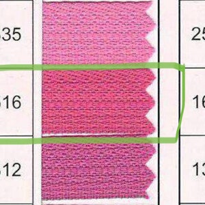 May include: A pink fabric swatch with three different shades of pink. The numbers 335, 516, 312, 256, 166, and 139 are printed on the fabric swatch.