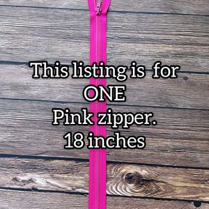 May include: A pink zipper measuring 18 inches long. This listing is for one zipper.