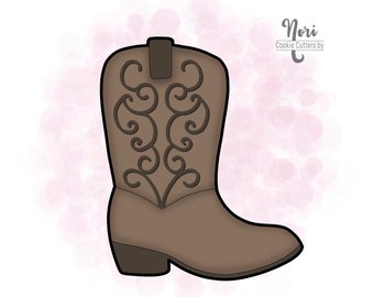 May include: A brown cowboy boot cookie cutter with a decorative design on the shaft. The cutter is made of metal and is designed for making cookies.