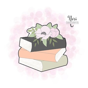 May include: A cookie cutter in the shape of a stack of three books, topped with a floral arrangement of pink flowers and green leaves. The books are colored in shades of gray, peach, and light green. The text "Nori Cookie Cutters by" is in the upper right corner.