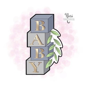 May include: A cookie cutter in the shape of stacked blocks spelling out "BABY" with a leafy sprig on the side. The blocks are gray with gold lettering. The cookie cutter is on a pink watercolor background.