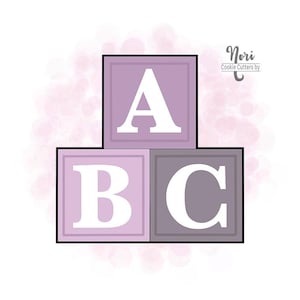 May include: Three purple and gray wooden blocks stacked on top of each other. The top block has the letter "A" on it, the middle block has the letter "B" on it, and the bottom block has the letter "C" on it. The blocks are on a white background with a pink watercolor design.