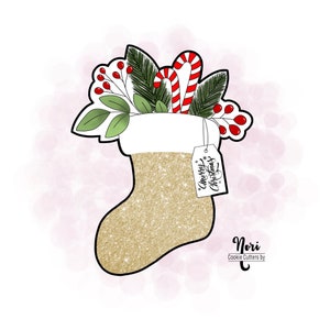May include: Gold glitter Christmas stocking cookie cutter with a white top, candy canes, holly, and a tag that says "Merry Christmas".
