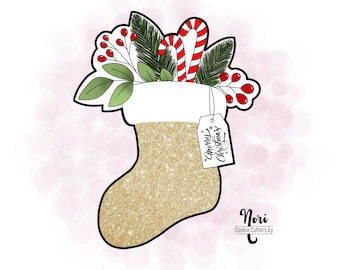 May include: Gold glitter Christmas stocking cookie cutter with a white top, candy canes, holly, and a tag that says "Merry Christmas".