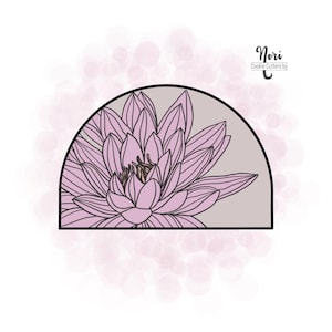 May include: A pink flower cookie cutter in the shape of a lotus flower. The cutter is in a half-circle shape with a gray background. The text "Nori Cookie Cutters by" is in the top right corner of the image.