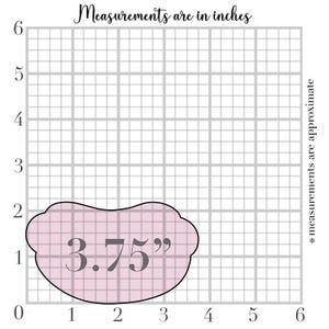 May include: A light pink cookie cutter with a scalloped edge, measuring 3.75 inches. The image includes a grid background with the text "Measurements are in inches" and "* measurements are approximate."