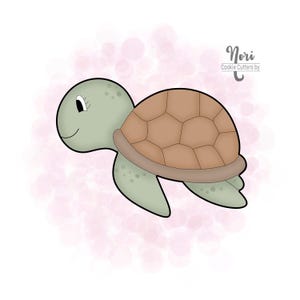 May include: A cartoon turtle illustration with a light green head and limbs, a brown shell, and a smiling face. The turtle is set against a soft pink background with bokeh effects. The text "Nori Cookie Cutters by" is in the upper right corner.