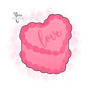 May include: A pink heart-shaped cookie cutter with the word "love" in cursive script. The cutter has a black outline and a decorative border of pink ovals. The design is on a white background with pink watercolor-style accents.