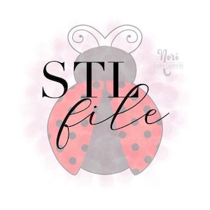 May include: A digital illustration of a ladybug cookie cutter design. The ladybug has red wings with black polka dots, a gray body, and the words "STL file" in black script. The design includes a watercolor-style pink background.