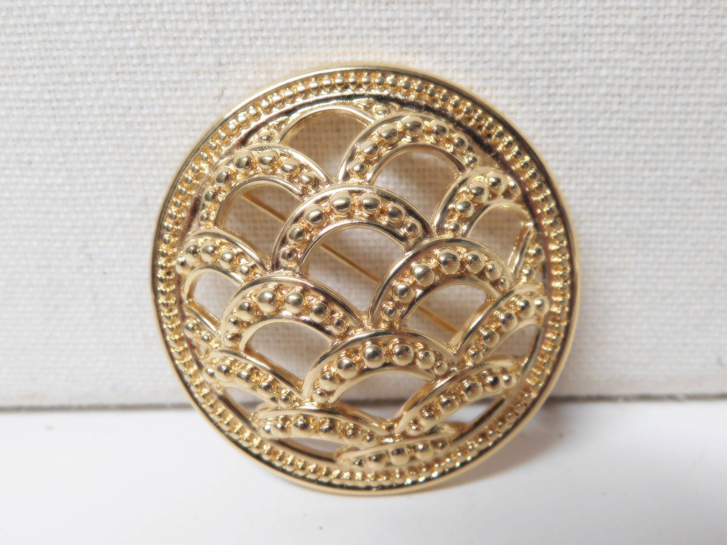 Vintage pins brooches a white enamel leaf and a round wave like