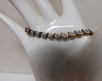 Sterling Silver Tennis Bracelet with little Diamond Chips and an added Heart Charm