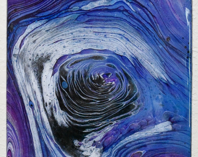 The Eye. Galaxy Acrylic Pour painting, 12" Square, fluid art, swirls of metallic blue, purple, pearl white and black that resemble a galaxy