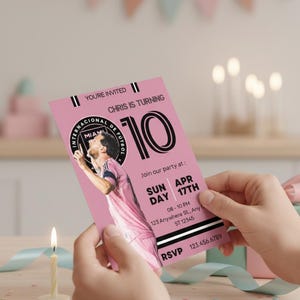 May include: A pink birthday party invitation with the text "YOU'RE INVITED" and "CHRIS IS TURNING 10". The invitation features a soccer player and party details. A lit candle and decorative ribbons are in the foreground.