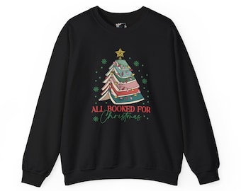 May include: Black sweatshirt with a Christmas tree design made of books. The tree is decorated with lights and topped with a gold star. The text "ALL BOOKED FOR Christmas" is printed below the tree in green.