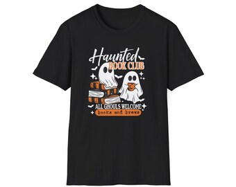 May include: A black short-sleeve t-shirt featuring a graphic of two white ghosts, one sitting on a stack of books and the other holding a mug. The text reads Haunted Book Club, All Ghouls Welcome, and books and brews, accented by small bats and stars.