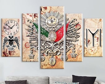 May include: A five-piece canvas wall art set featuring a vintage-style map with a stylized depiction of the Turkish coat of arms. The coat of arms includes a double-headed eagle, a crescent moon, a star, and a red and green flag. The set also includes a clock face and a stylized Turkish symbol.