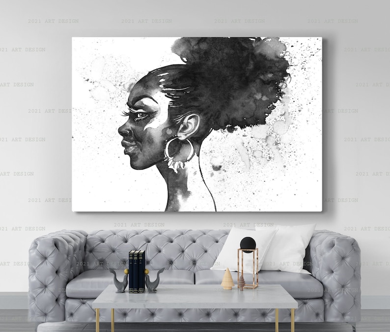May include: Black and white watercolor portrait of a woman in profile. The artwork features a dark-skinned woman with large hoop earrings and her hair styled in a bun. The background has a splattered ink effect. The artwork is displayed on a white canvas.