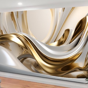 Può includere: Arte da parete astratto con un design a spirale di bianco e oro. Il design ricorda nastri o onde che scorrono.