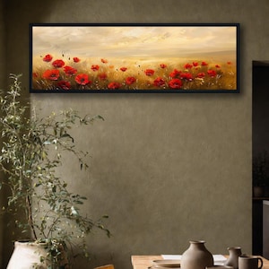 Puede incluir: Pintura paisajística enmarcada con un campo de amapolas rojas bajo un cielo dorado. La obra de arte está en un marco negro rectangular, con las vibrantes flores rojas contrastando con los tonos cálidos y neutros del fondo.