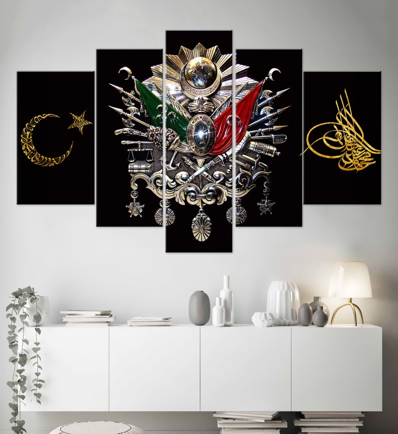 May include: A five-piece canvas print set featuring a stylized depiction of the Turkish coat of arms. The coat of arms is a silver and gold design with a crescent moon and star, a red and green flag, and a sword. The background is black.