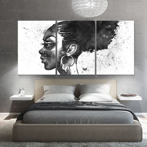 May include: A triptych canvas art piece featuring a black and white watercolor portrait of a woman. The artwork showcases the woman's profile, with focus on her face, hair, and large hoop earrings. The background has a splattered paint effect.