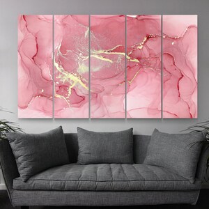 May include: Abstract art print with a pink and gold color scheme. The print is divided into five panels, each featuring a swirling, marbled pattern with gold accents.