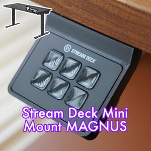 Könnte beinhalten: Schwarze Stream Deck Mini Halterung für einen Schreibtisch, beschriftet mit "Stream Deck Mini Mount MAGNUS".