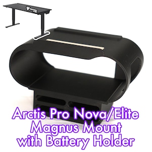 May include: Black Magnus mount with battery holder for Arctis Pro Nova/Elite headsets. The mount has a curved design with a rectangular base and a white accent. A black desk is in the background.