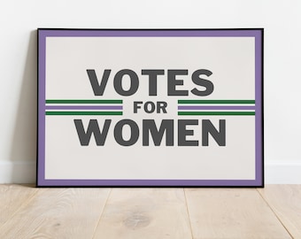 May include: A framed poster with a white background and black text that reads "Votes for Women". The text is framed by two green stripes and a purple border.