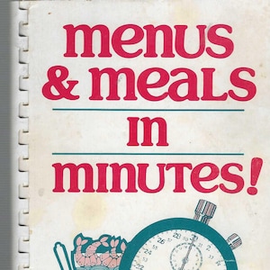May include: A vintage cookbook titled "Menus & Meals in Minutes!" by Marty Sprague with a foreword by Emilie Barnes. The cover features a cartoon illustration of a shrimp cocktail and a stopwatch.