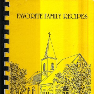 May include: A yellow cover with black text that reads "Favorite Family Recipes at Friedens United Church of Christ Geronimo, Texas". The cover features a black and white line drawing of a church building with a steeple.