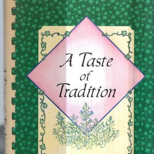 May include: A green book with a pink diamond-shaped cover that says "A Taste of Tradition" and "A Collection of Recipes by AORN of North Harris/Montgomery County".