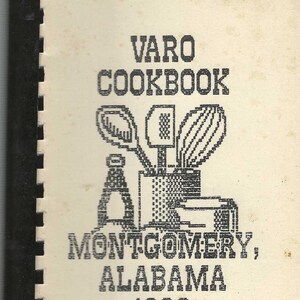 May include: Black and white image of a cookbook cover with the title "VARO COOKBOOK" and the text "MONTGOMERY, ALABAMA 1986". The cover features a stylized illustration of kitchen utensils.