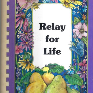 May include: A purple book with a spiral binding. The cover features a floral border with pears and the text "Relay for Life".