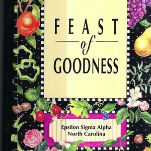 May include: A black and white cookbook with a yellow cover titled "Feast of Goodness" with a floral design and the text "Epsilon Sigma Alpha North Carolina".
