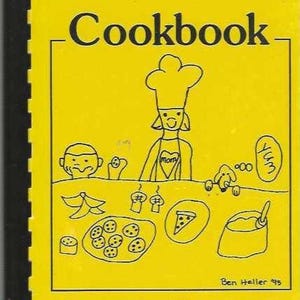 May include: A yellow cookbook titled "Carruthers Cookbook" with black text and a black spiral binding. The cover features a cartoon chef and various food illustrations. The text "Carruthers Elementary 1995" is at the bottom.