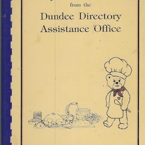 May include: A vintage cookbook cover with the title "Recipes Old and New" and the text "Dundee Directory Assistance Office." A cartoon bear chef is featured, along with illustrations of food. The cover is cream-colored with a blue spine.