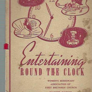 May include: A vintage cookbook cover with a red clock face and illustrations of a rooster, a bird, and a chef. The text reads "Entertaining 'Round The Clock" and "Women's Missionary Association of First Brethren Church Macomb, Illinois".
